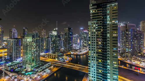Beautiful aerial top view at night timelapse of Dubai Marina in Dubai  UAE