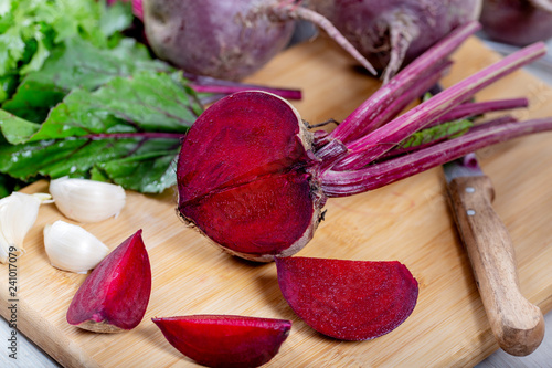 beet with leaves on wooden background