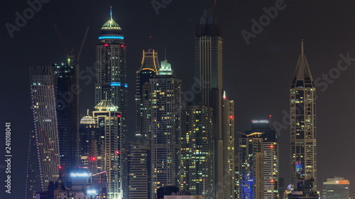 Beautiful aerial top view at night timelapse of Dubai Marina in Dubai, UAE