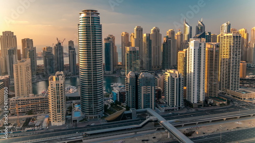Beautiful aerial top view at sunset timelapse of Dubai Marina and JLT in Dubai, UAE