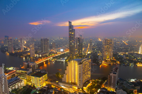Aerial view Bangkok metropolis city skyline cityscape night sunset with Chao Phraya River in Thailand Asia