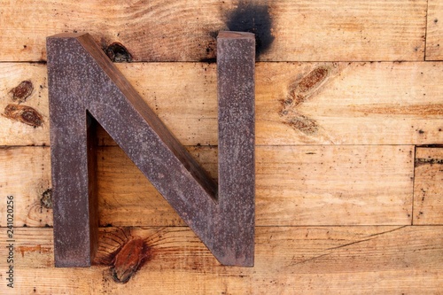 Letter N made of rusty iron