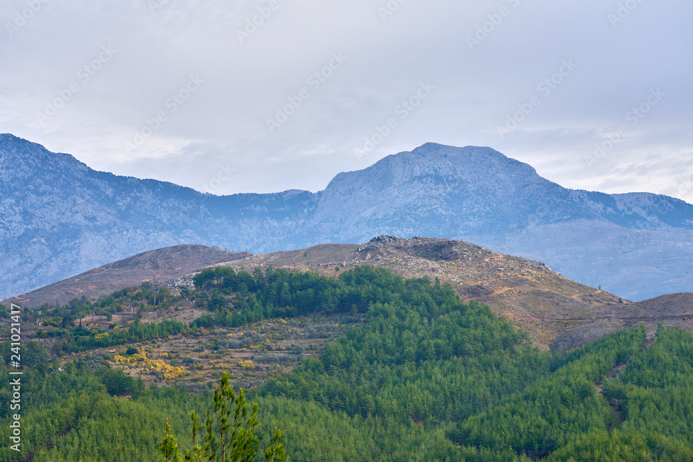 Naklejka premium Mountains near Alanya, Turkey under a cloudy sky. 