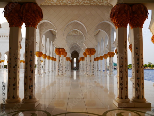 famous colonnade of Sheikh Zayed Grand Mosque in Abu Dhabi, the capital city of the United Arab Emirates