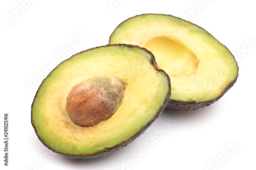 ASliced Avocado with its Pit on White Background