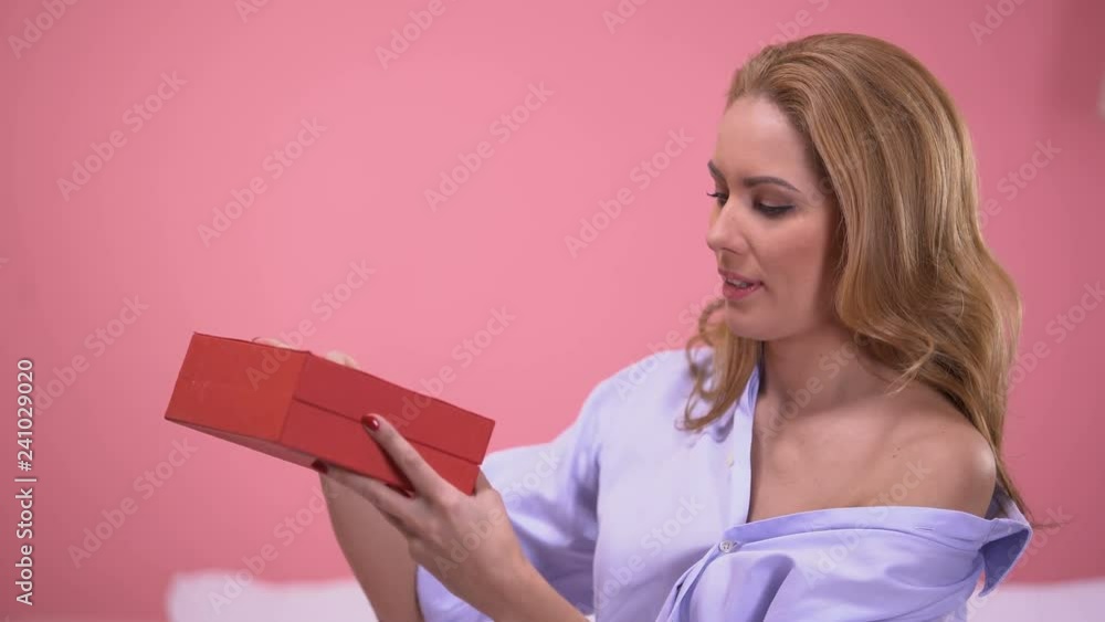 Seductive woman very happy with precious present in red gift box, Valentines day Seductive woman very happy with precious present in red gift box, Valentines day