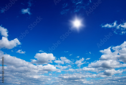 Sun in bright blue sky.