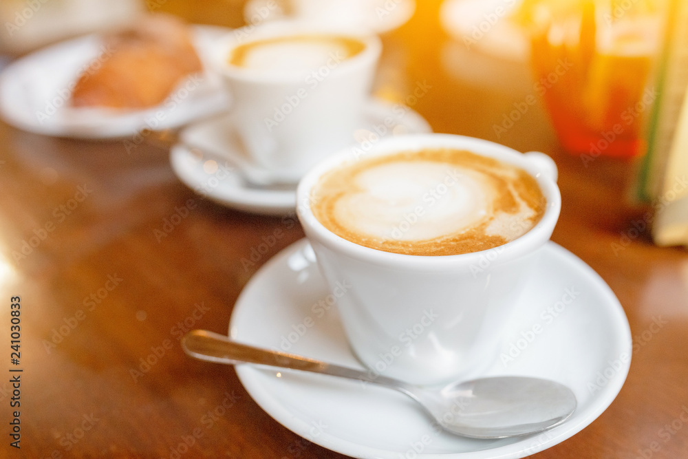 Cappuccino coffee cup on the table in cafe Cappuccino coffee cup on the table in cafe