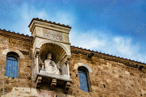 Cathedral Basilica of Santa Maria Annunziata, in Piazza Innocenzo III. Niche with the statue of Pope Boniface VIII, seated and blessing, on the cathedral terrace. Anagni, Frosinone, Italy. photo