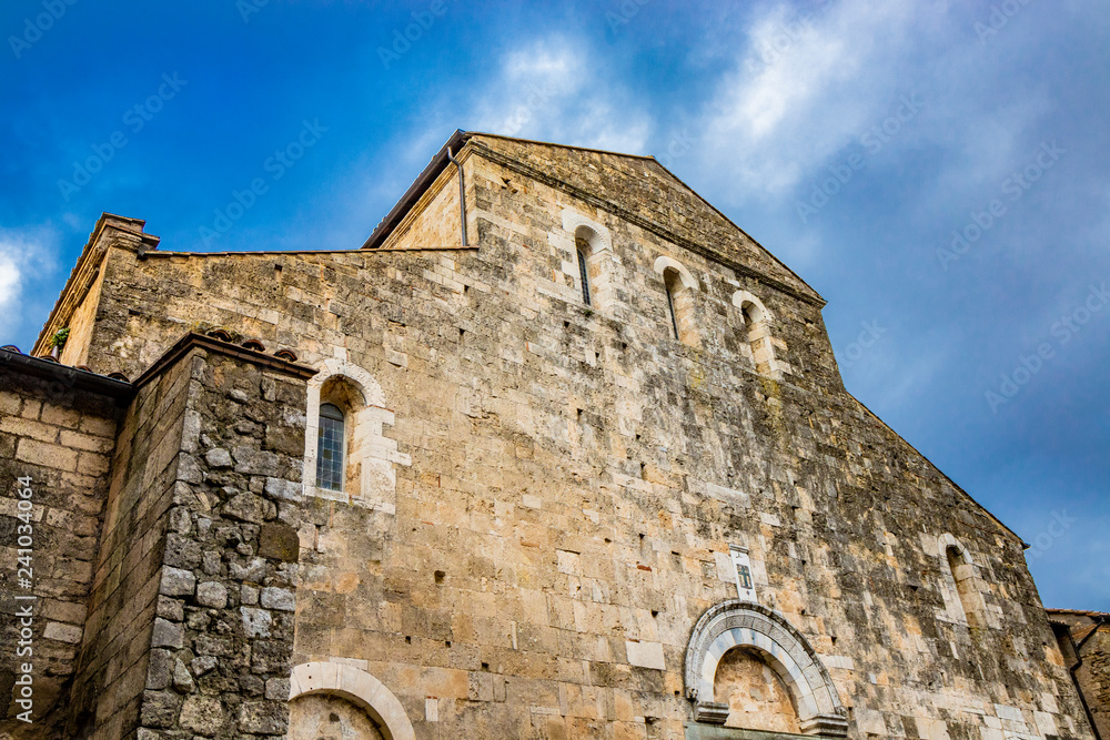 Stone facade of the cathedral of Santa Maria Annunziata, in Romanesque style, with a cusp and three portals. Anagni, Frosinone, Italy.