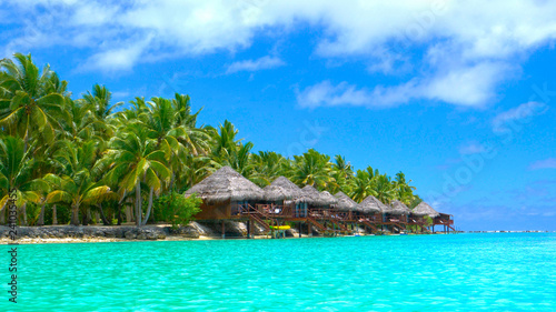 Vászonkép Beautiful luxury overwater villas face the stunning turquoise ocean water