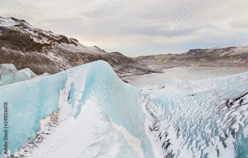 Solheimajokull glacier (Sólheimajökull) in the south of Iceland is popular with ice climbers and a popular tourist location owing to its size and relative ease of access. photo