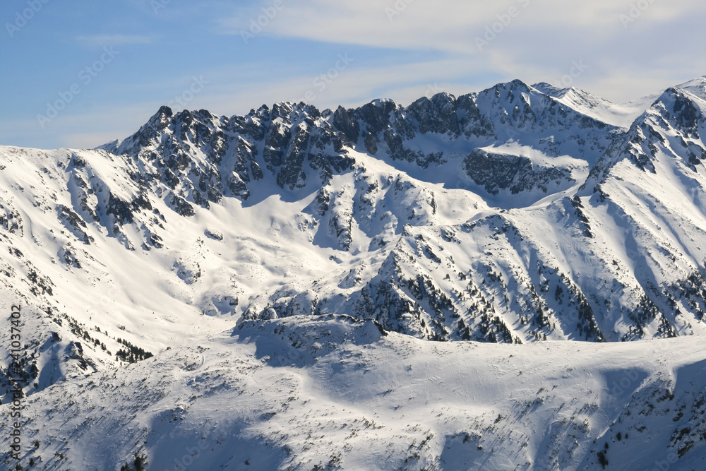 Winter landscape with hills covered with snow at Pirin Mountain, view from Todorka peak, Bulgaria