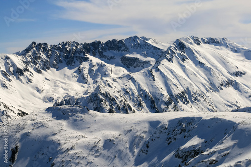 Winter landscape with hills covered with snow at Pirin Mountain, view from Todorka peak, Bulgaria