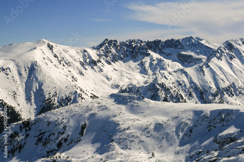 Winter landscape with hills covered with snow at Pirin Mountain  view from Todorka peak  Bulgaria
