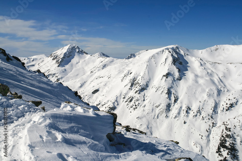 Winter landscape with hills covered with snow at Pirin Mountain  view from Todorka peak  Bulgaria