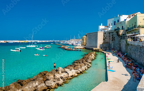 People on the beach in Otranto city on the coast of Italy