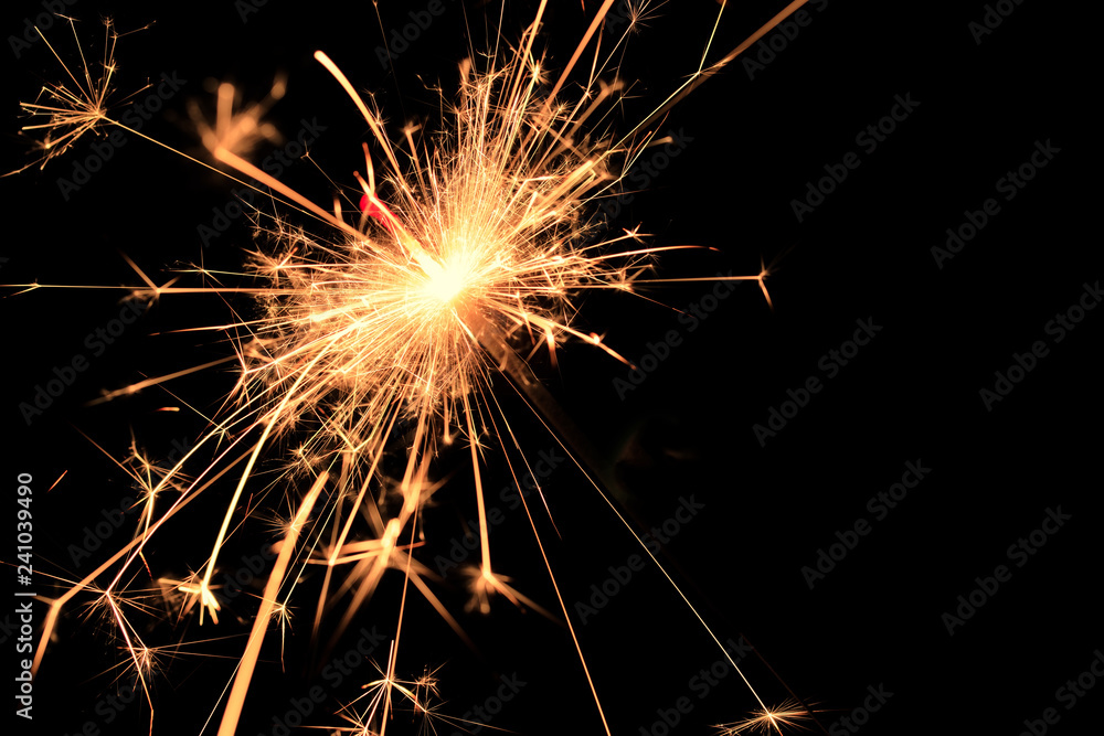 Bengal fire fireworks on black background / sparkling fireworks on black macro background