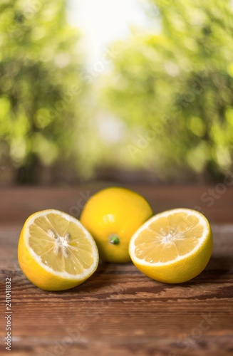 lemon fruits isolated on wooden table. lemon slices. lemon background