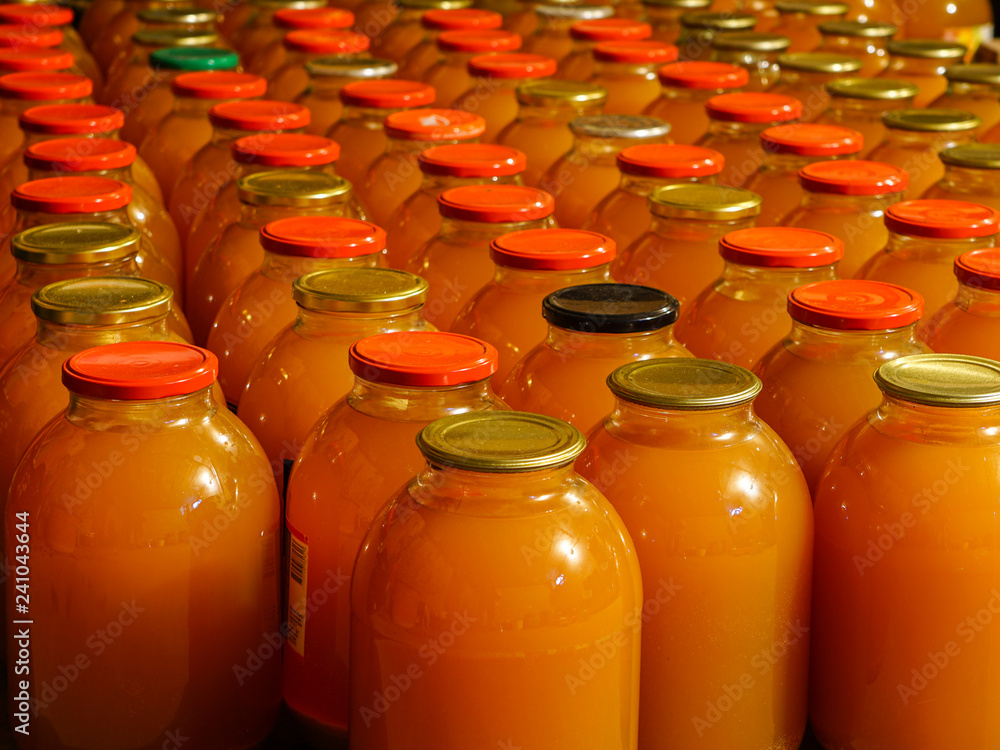 homemade apple juice in three liter glass jars homemade apple juice in three liter glass jars