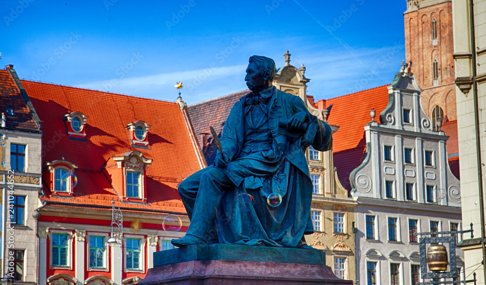 Monument to Alexander Fredro on Rynek Square in Wroclaw in Poland - obrazy, fototapety, plakaty 