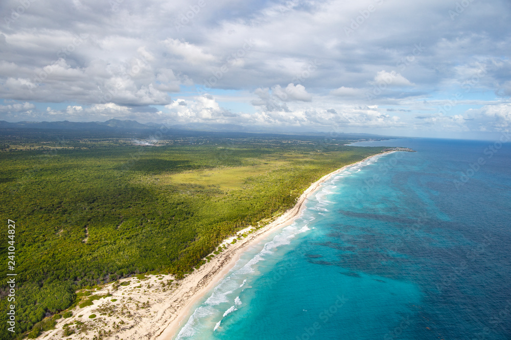 Fototapeta premium Coastal zone of the Dominican Republic. View from the cockpit of the helicopter.