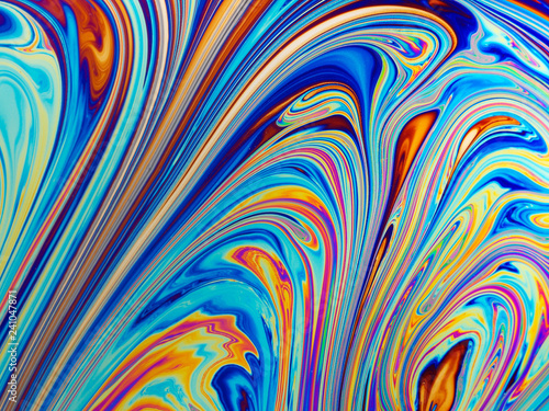 Colourful psychedelic soap bubble refractions pattern macro. photo