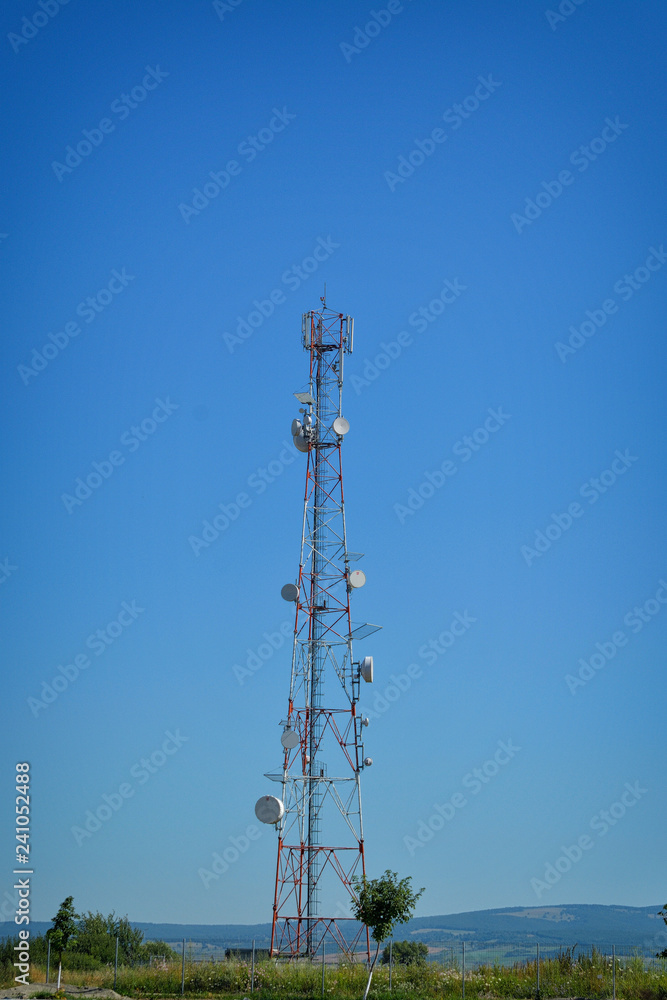 Telecommunications tower.Image contain certain grain or noise and soft focus. Telecommunications tower.Image contain certain grain or noise and soft focus.