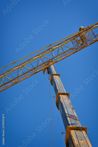 High arms of crane in building site