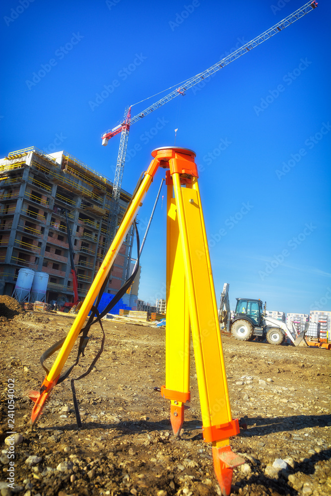 Surveyor tripod outdoors at construction site Surveyor tripod outdoors at construction site