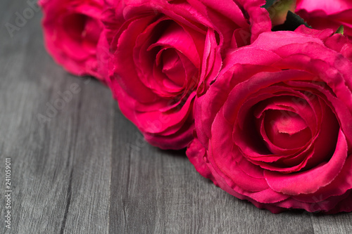 Pink rose flowers bouquet with copy space on wooden background. Valentine's Day