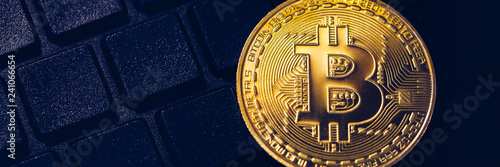 Wallpaper Mural Bitcoin on compuer keyboard in background, symbol of electronic virtual money and mining cryptocurrency concept. Coin crypto currency bitcoin lies on the keyboard. Bitcoin on keyboard. Torontodigital.ca