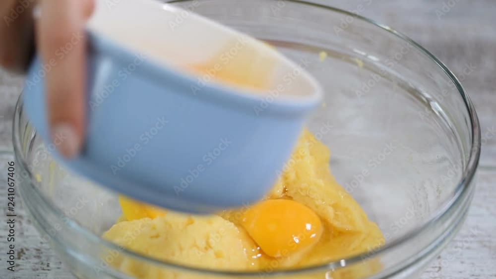 Mixing ingredients to make choux pastry at home. Mixing ingredients to make choux pastry at home.