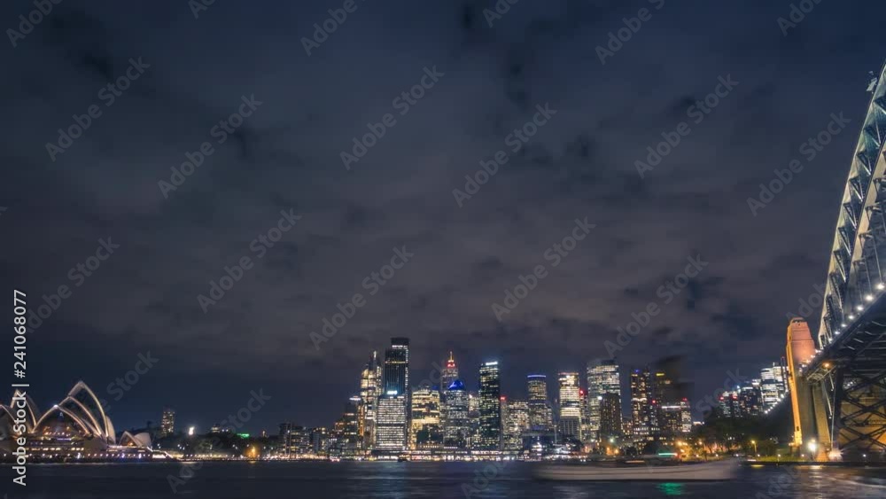 Sydney at night. Timelapse video with all iconic buildings in Sydney, busy harbour and cityscape of the skyscrapers and office towers in the city centre. Sydney at night. Timelapse video with all iconic buildings in Sydney, busy harbour and cityscape of the skyscrapers and office towers in the city centre.