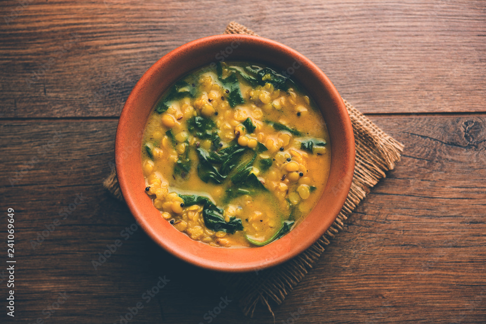 Dal Palak or Lentil spinach curry - popular Indian main course healthy recipe. served in a karahi/pan or bowl. selective focus Dal Palak or Lentil spinach curry - popular Indian main course healthy recipe. served in a karahi/pan or bowl. selective focus