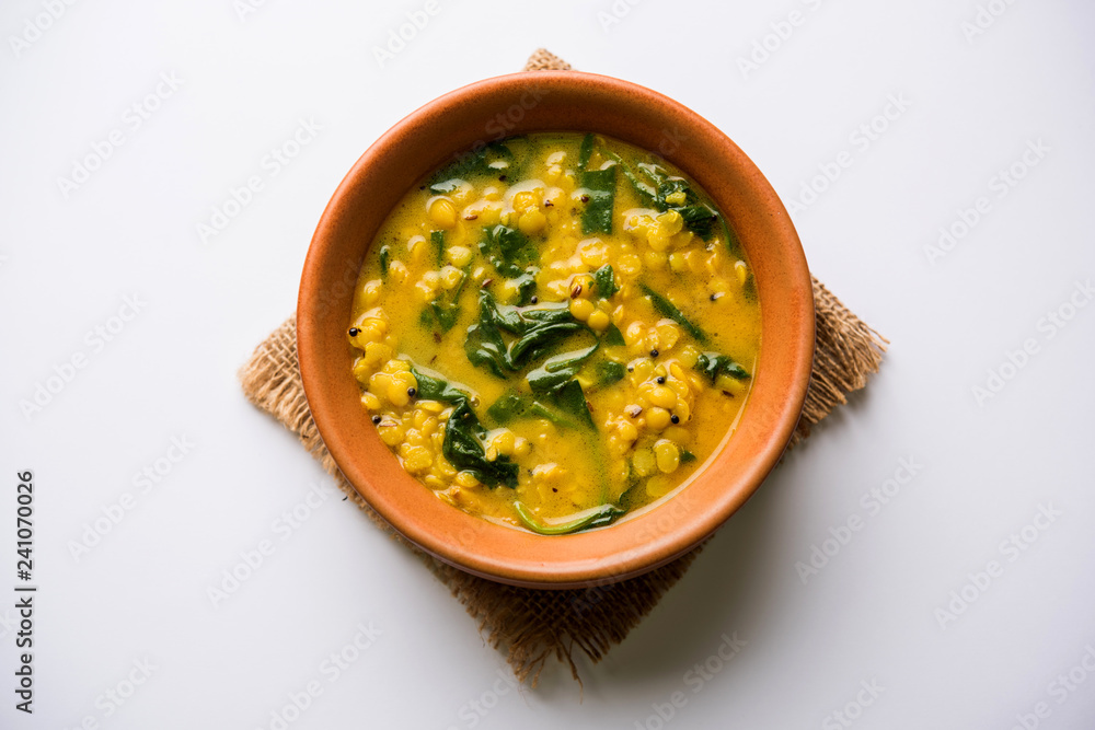 Dal Palak or Lentil spinach curry - popular Indian main course healthy recipe. served in a karahi/pan or bowl. selective focus Dal Palak or Lentil spinach curry - popular Indian main course healthy recipe. served in a karahi/pan or bowl. selective focus