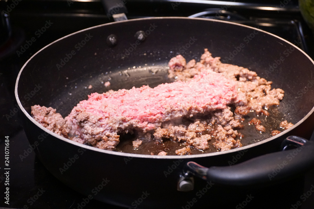Ground beef cooking in frying pan Ground beef cooking in frying pan