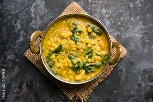 Dal Palak or Lentil spinach curry - popular Indian main course healthy recipe. served in a karahi/pan or bowl. selective focus photo