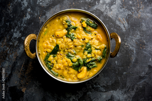 Dal Palak or Lentil spinach curry - popular Indian main course healthy recipe. served in a karahi/pan or bowl. selective focus photo