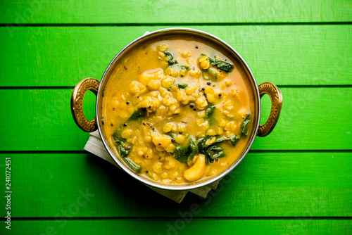 Dal Palak or Lentil spinach curry - popular Indian main course healthy recipe. served in a karahi/pan or bowl. selective focus photo