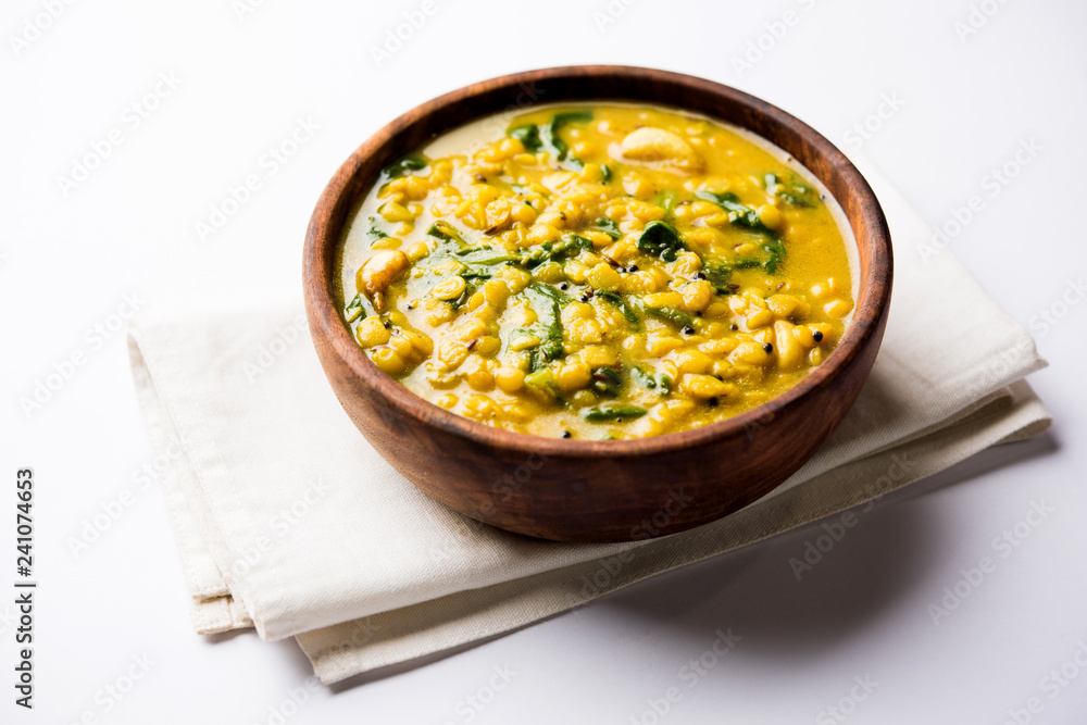 Dal Palak or Lentil spinach curry - popular Indian main course healthy recipe. served in a karahi/pan or bowl. selective focus Dal Palak or Lentil spinach curry - popular Indian main course healthy recipe. served in a karahi/pan or bowl. selective focus
