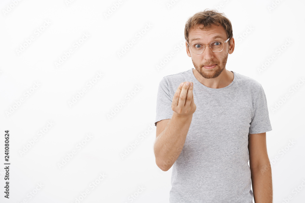 No money no honey. Portrait of demanding displeased funny caucasian guy in glasses with bristle making italian gesture pursing lips asking employees where is income over white background No money no honey. Portrait of demanding displeased funny caucasian guy in glasses with bristle making italian gesture pursing lips asking employees where is income over white background