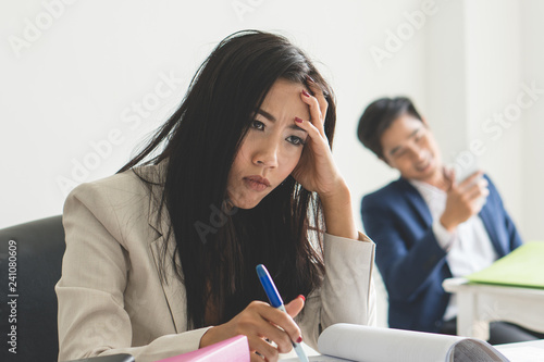Boredom office work. Asian employee feeling bored her job at workplace and want to change the job.