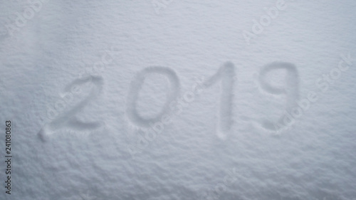 abstract winter New Year's and Christmas background from snow.text on snow 2019