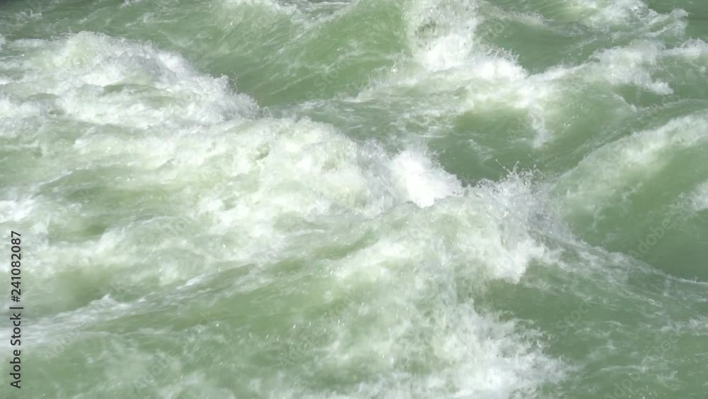 Beautiful water in a mountain river in slow motion video. Beautiful ganga river near Rishikesh, India Beautiful water in a mountain river in slow motion video. Beautiful ganga river near Rishikesh, India