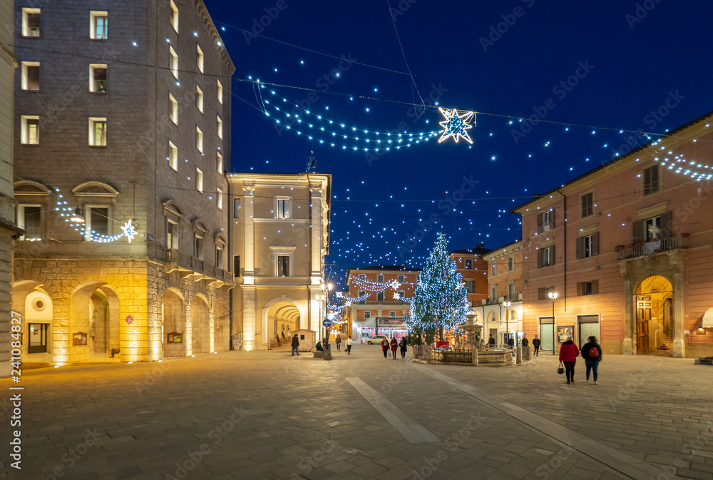 Rieti (Italy) - The historic center of the Sabina's provincial capital, under Mount Terminillo with snow and crossed by the river Velino, during the Christmas holidays