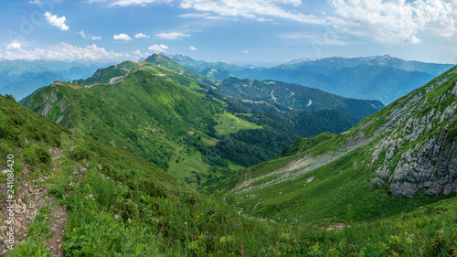 View over the Green Valley, surrounded by high mountains on a clear summer day