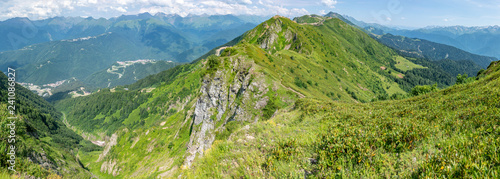 View of the high mountain range with cable cars. Aibga Ridge, Krasnaya Polyana, Sochi, Russia.