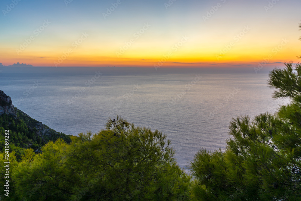 Greece, Zakynthos, Ideal colorful sunset sky over endless horizon of the sea