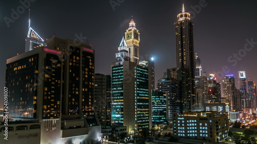 Downtown Dubai towers night timelapse. Aerial view of Sheikh Zayed road with skyscrapers.